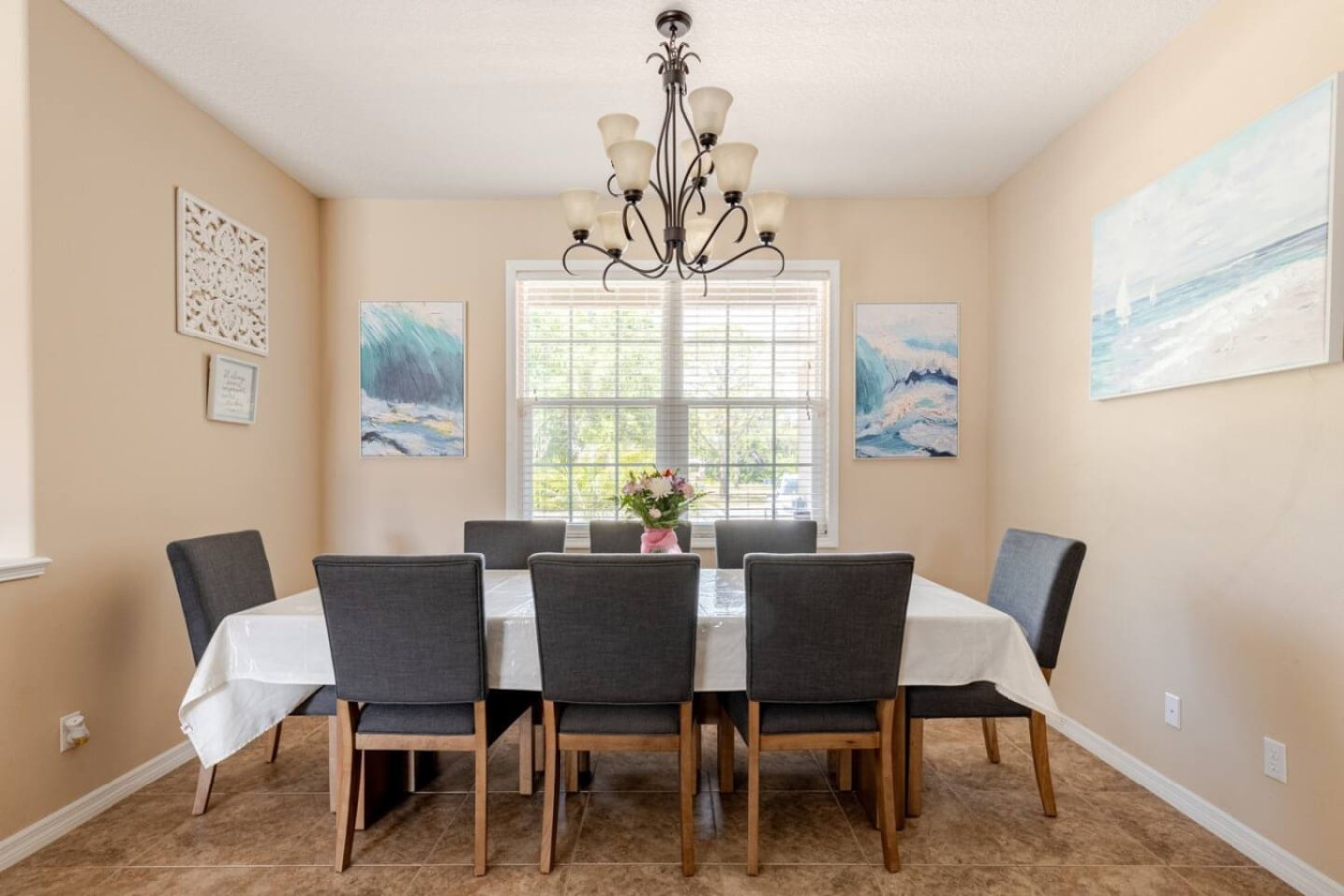 The dining room table, long enough to seat the whole group at once.