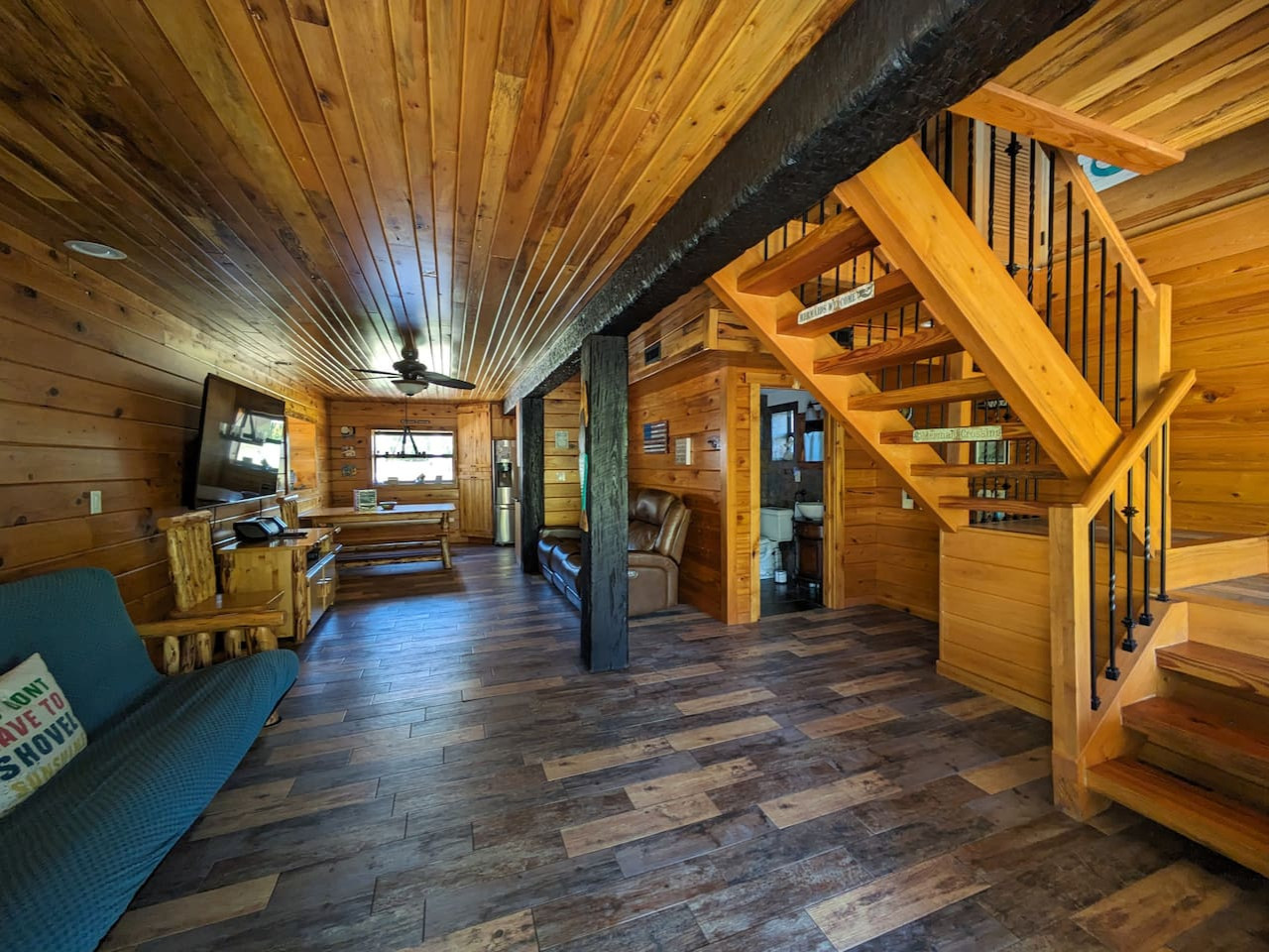 The living room and the staircase to the loft