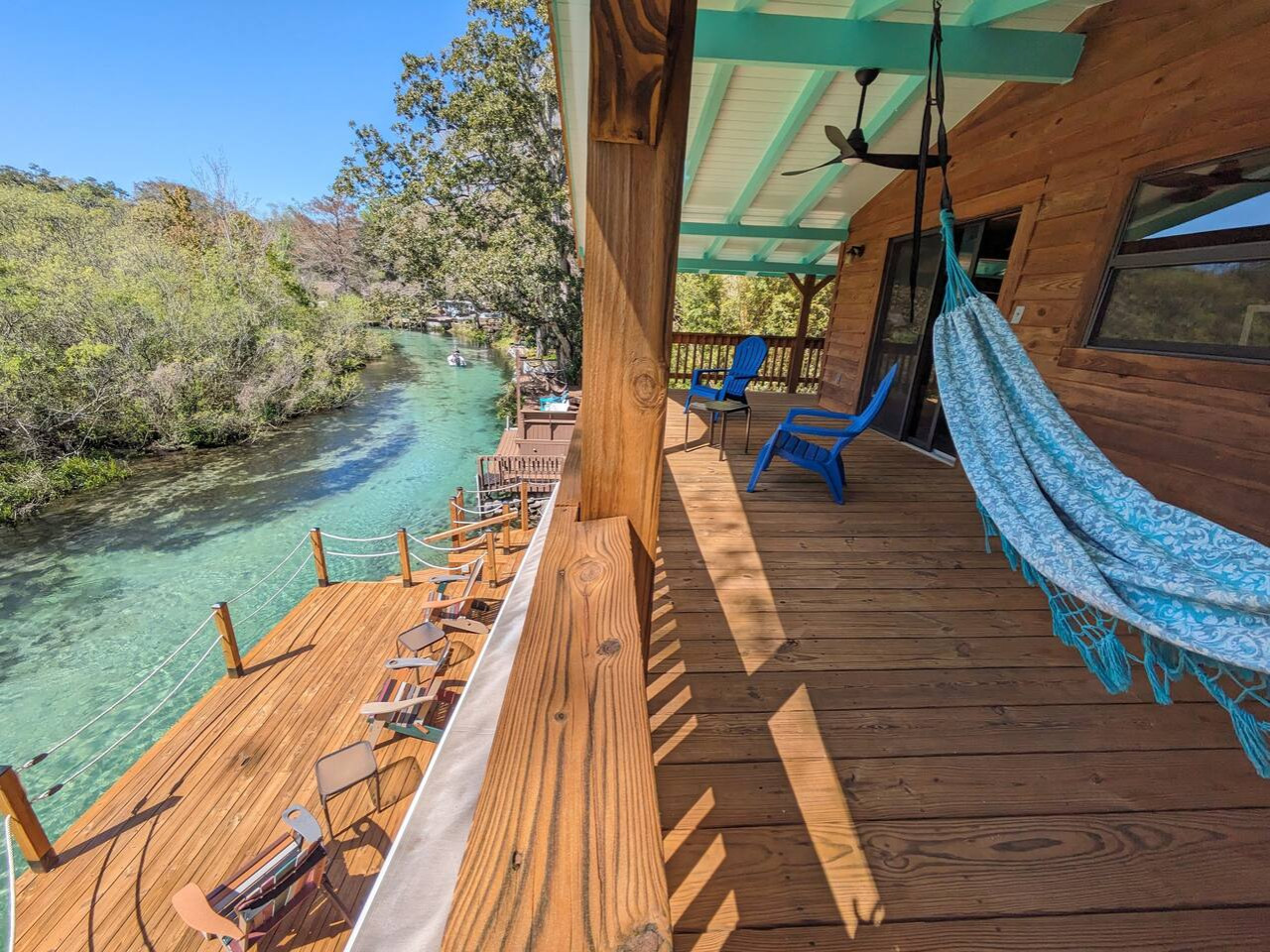 A hammock on the upper balcony, above the river