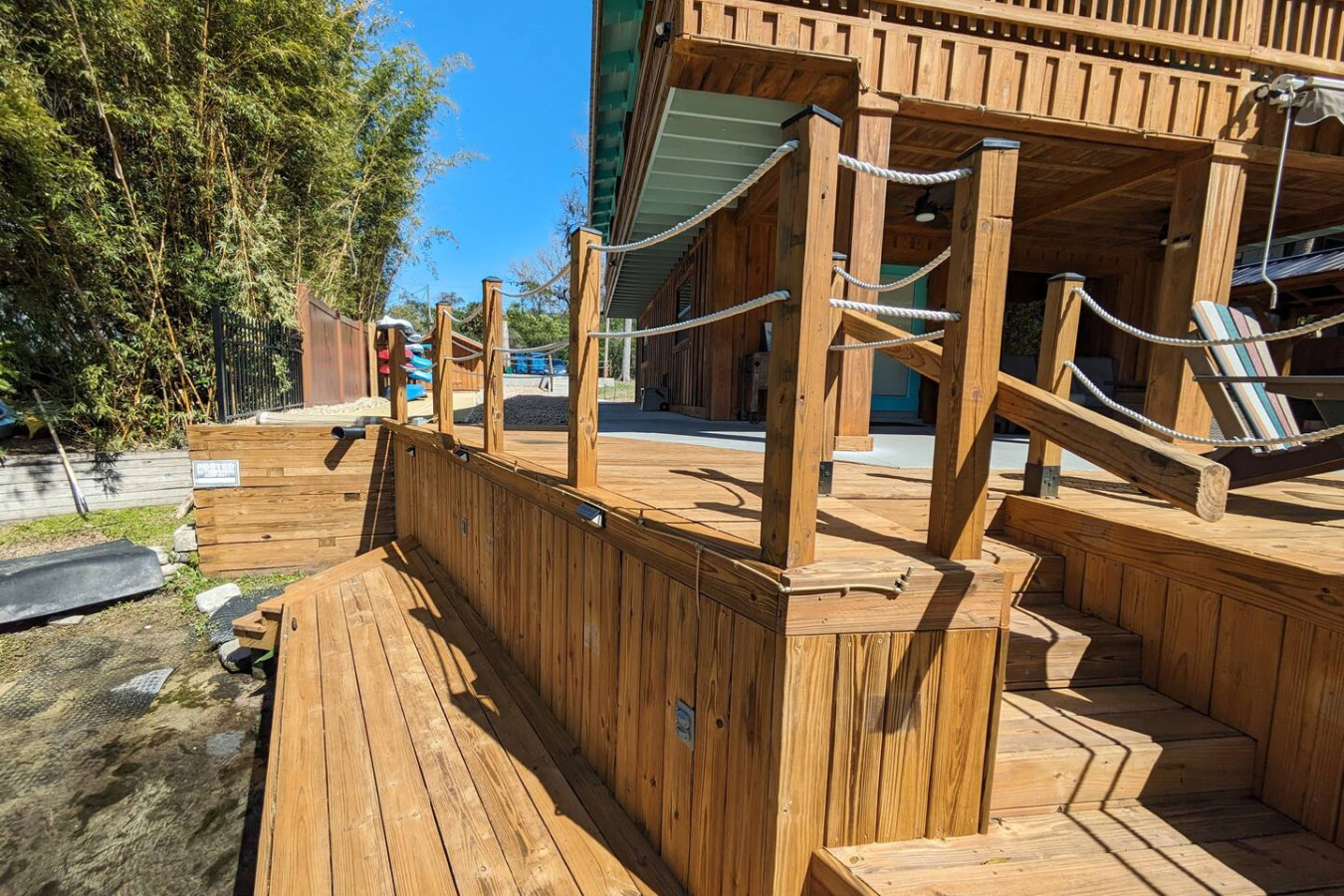 The deck and steps along the side of the house