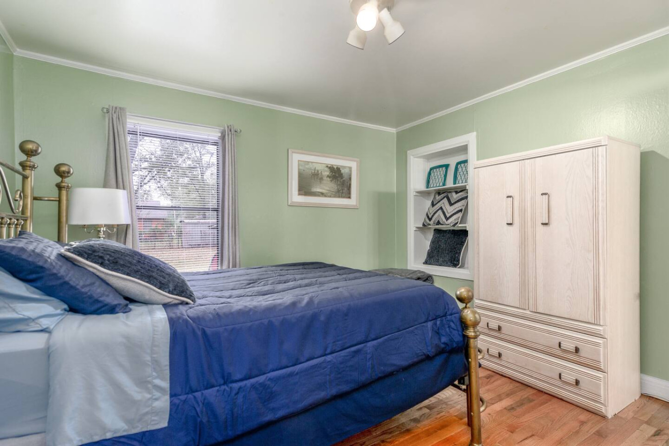 Room 2: The Green Room, features a comfy  Queen Brass Bed, Television and Private Bath