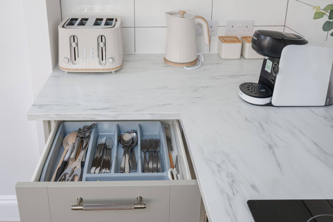 Tassimo coffee machine, 4 slice toaster, kettle and microwave.