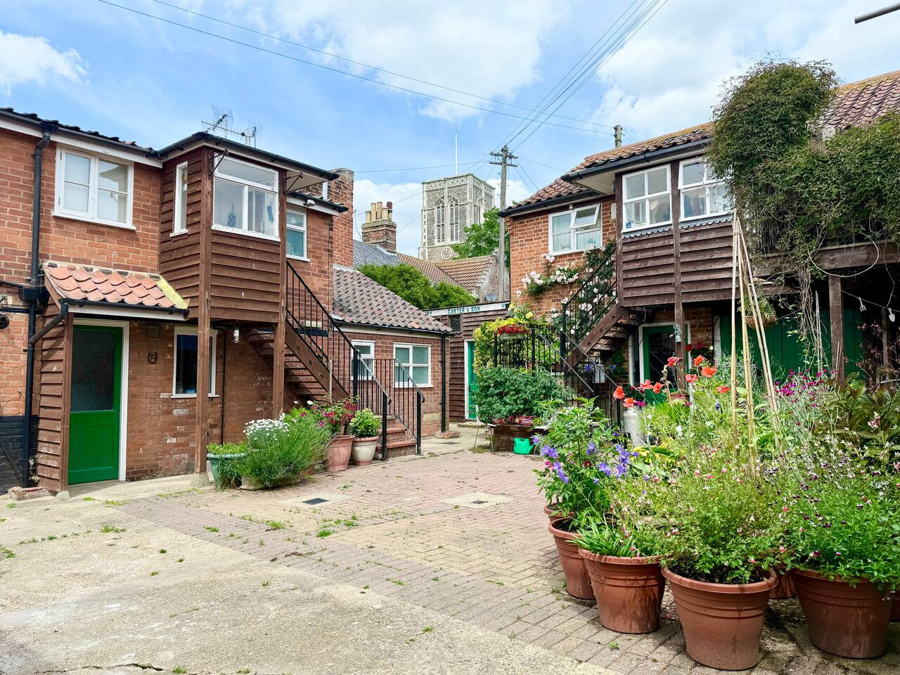 Stunning shared courtyard with views of the iconic St Edmund church to the north and Southwold lighthouse to the east.