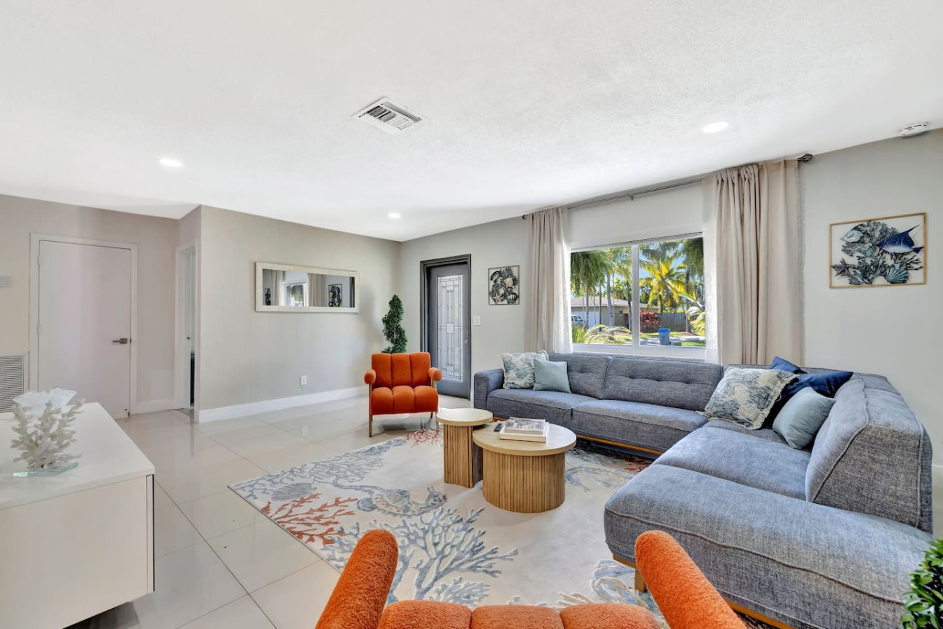 Our living room features large windows with room-darkening shades, offering both natural light and the option for privacy and tranquility whenever you desire.