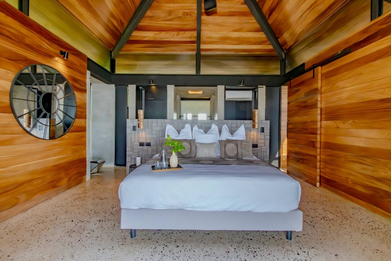 Drift to sleep under a canopy of stars and shimmering bay lights! You'll have a king bed, A/C, & a pullout for extra guests. Enjoy a spacious closet & adjoined bath. Your balcony connects directly to the pool area. Book your celestial Costa Rica stay