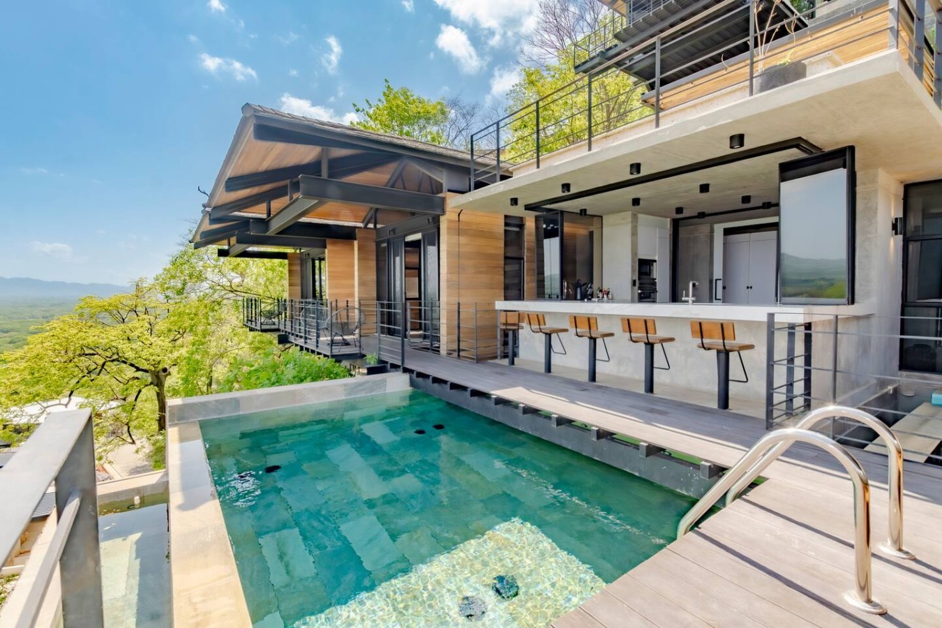 Our open kitchen, bar, & pool area seamlessly connect for effortless fun! Gather friends & family for great moments Enjoy easy access to refreshments and pool time. Enjoy your stay with a wine degustation or thrilling mixology experience  ask us how!
