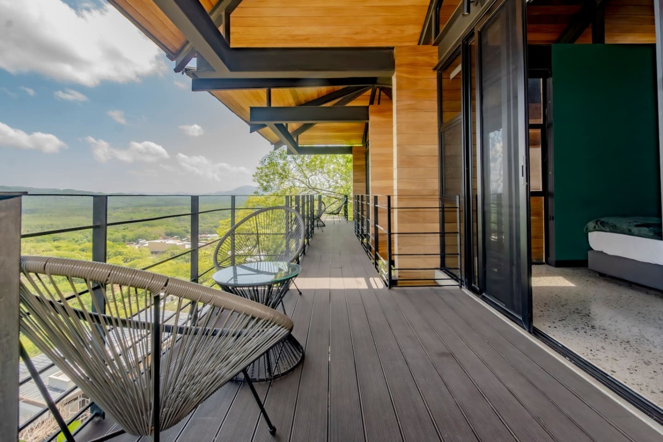 Step onto your balcony directly from the bedroom! Settle into the cozy coffee table perfect for a morning read or afternoon sips. Picture yourself immersed in breathtaking Costa Rican sights Your private moment of tranquility awaits – reserve it now!