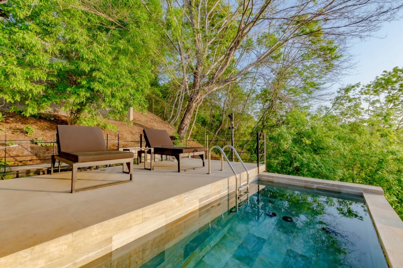 Welcome to your most private pool, exclusively for Bungalow 2! Lounge by day or enjoy a cool dip under the stars illuminated by fantastic LED lights. This serene oasis complete with loungers offers unmatched tranquility. Your secluded retreat awaits!