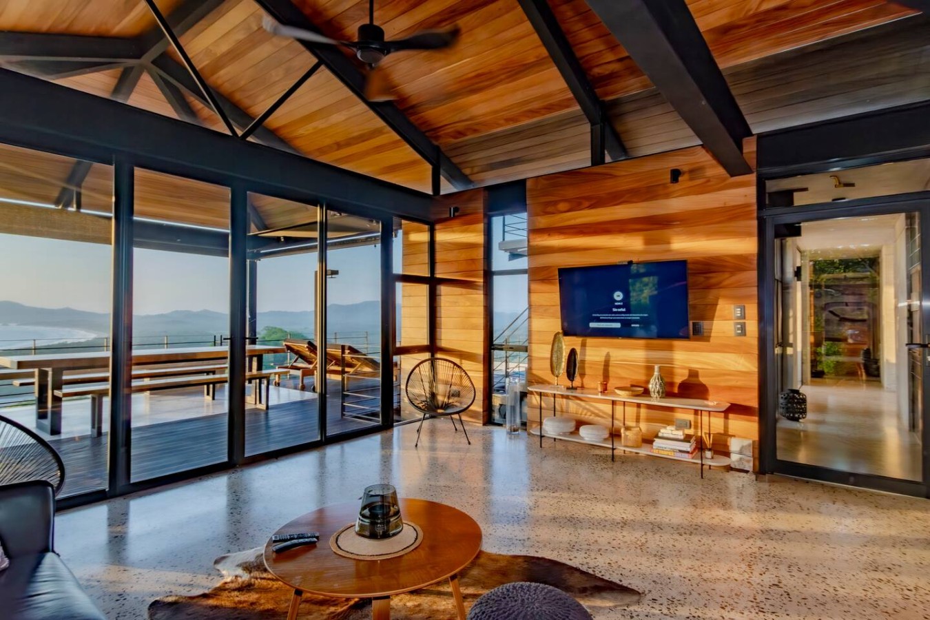 Bathed in natural light, our luxurious living room is your perfect retreat. Enjoy the 85-inch Smart TV or relax. The balcony offers stunning ocean & sunset views. Plan your Tamarindo escape! Ask our concierge about sport fishing or sunset catamarans.
