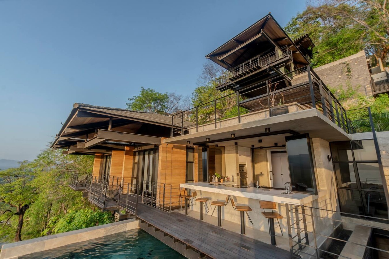 An architectural marvel nestled on the mountains! This luxurious home offers fantastic ocean & sunset views designed for ultimate getaways. Ready to host your vacation complete with a dedicated concierge to ensure perfection. Book your escape today!