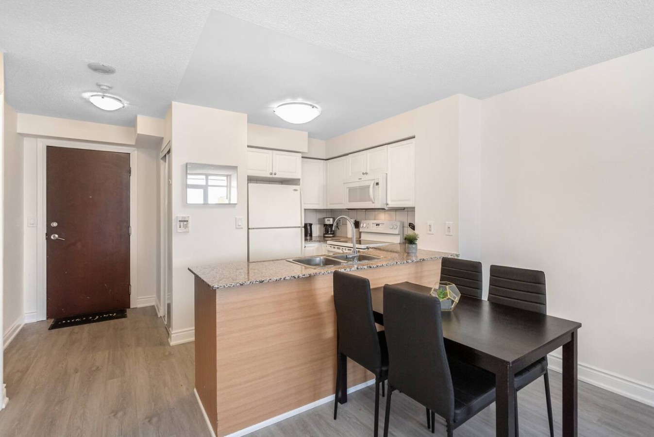 Stylish 2BR Retreat Steps to SQ1 | Prime Location — furnished suite photo 7 in Mississauga