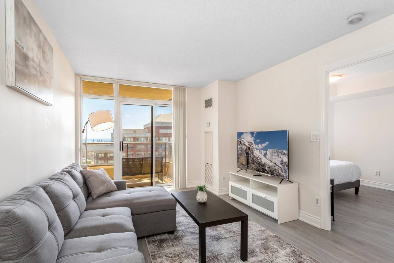 Stylish 2BR Retreat Steps to SQ1 | Prime Location — furnished suite photo 4 in Mississauga