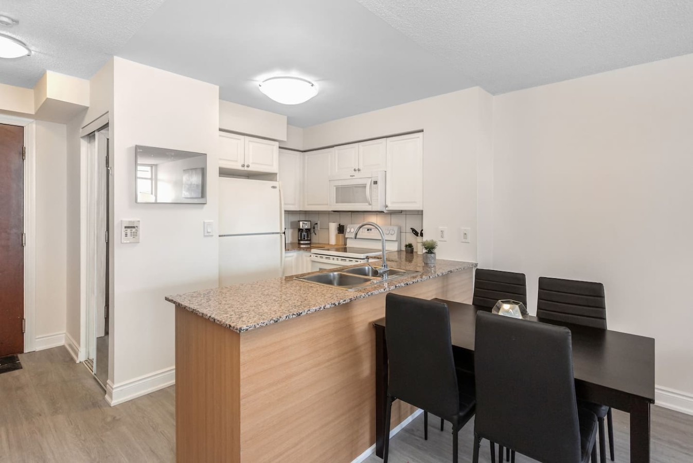Stylish 2BR Retreat Steps to SQ1 | Prime Location — furnished suite photo 45 in Mississauga