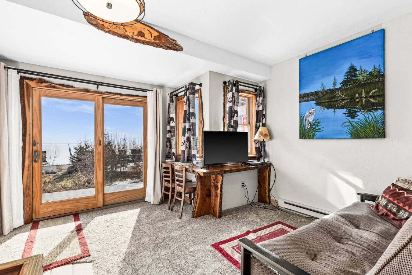 Main level views of lake with easy access outside