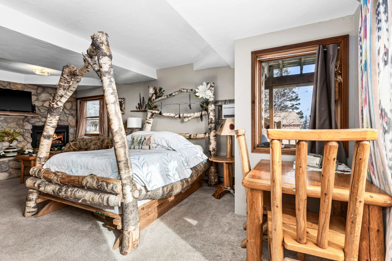 Queen bed is adorned with a dreamcatcher on the headboard.
