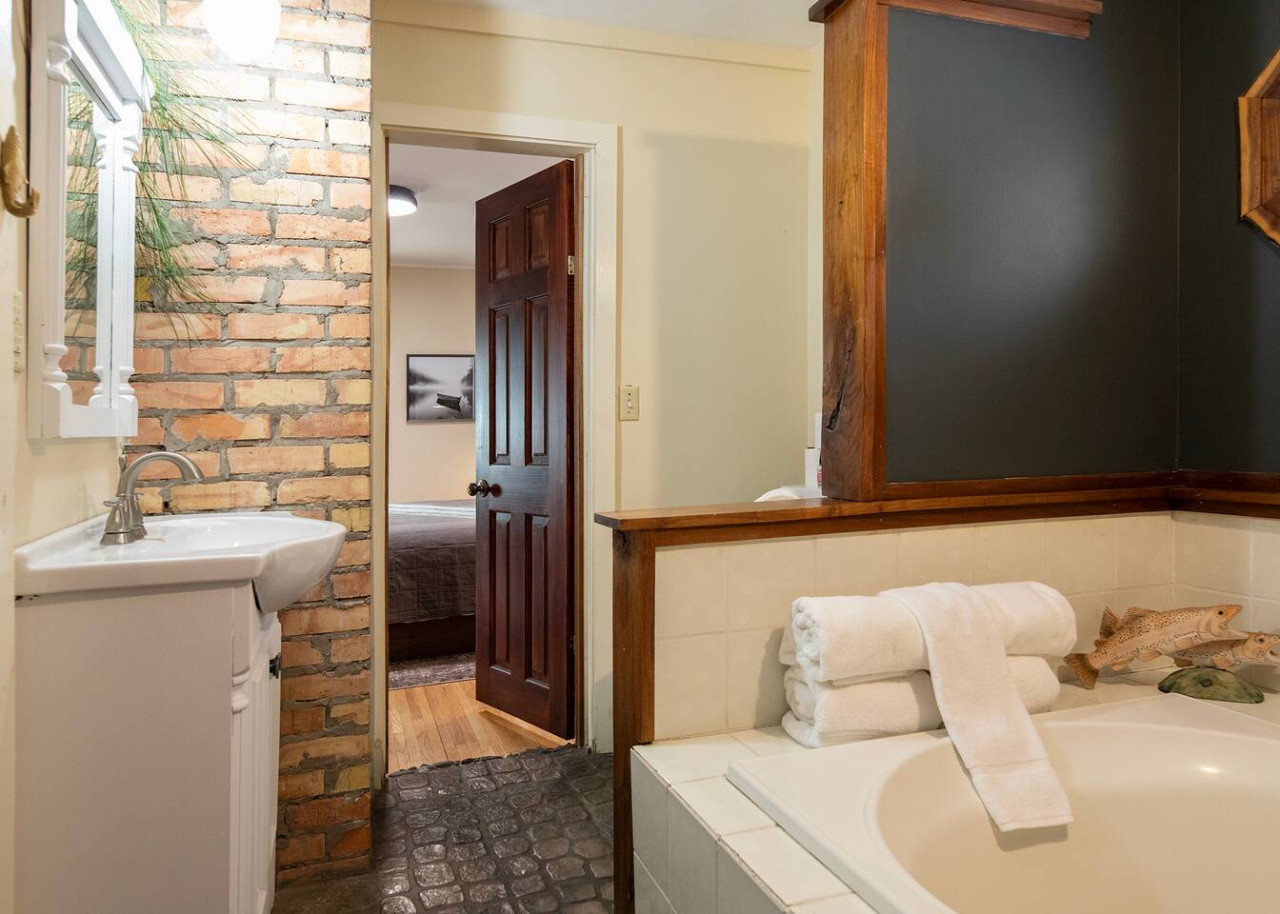 Refresh and relax in our spacious full bathroom, featuring modern amenities and a clean, inviting atmosphere.