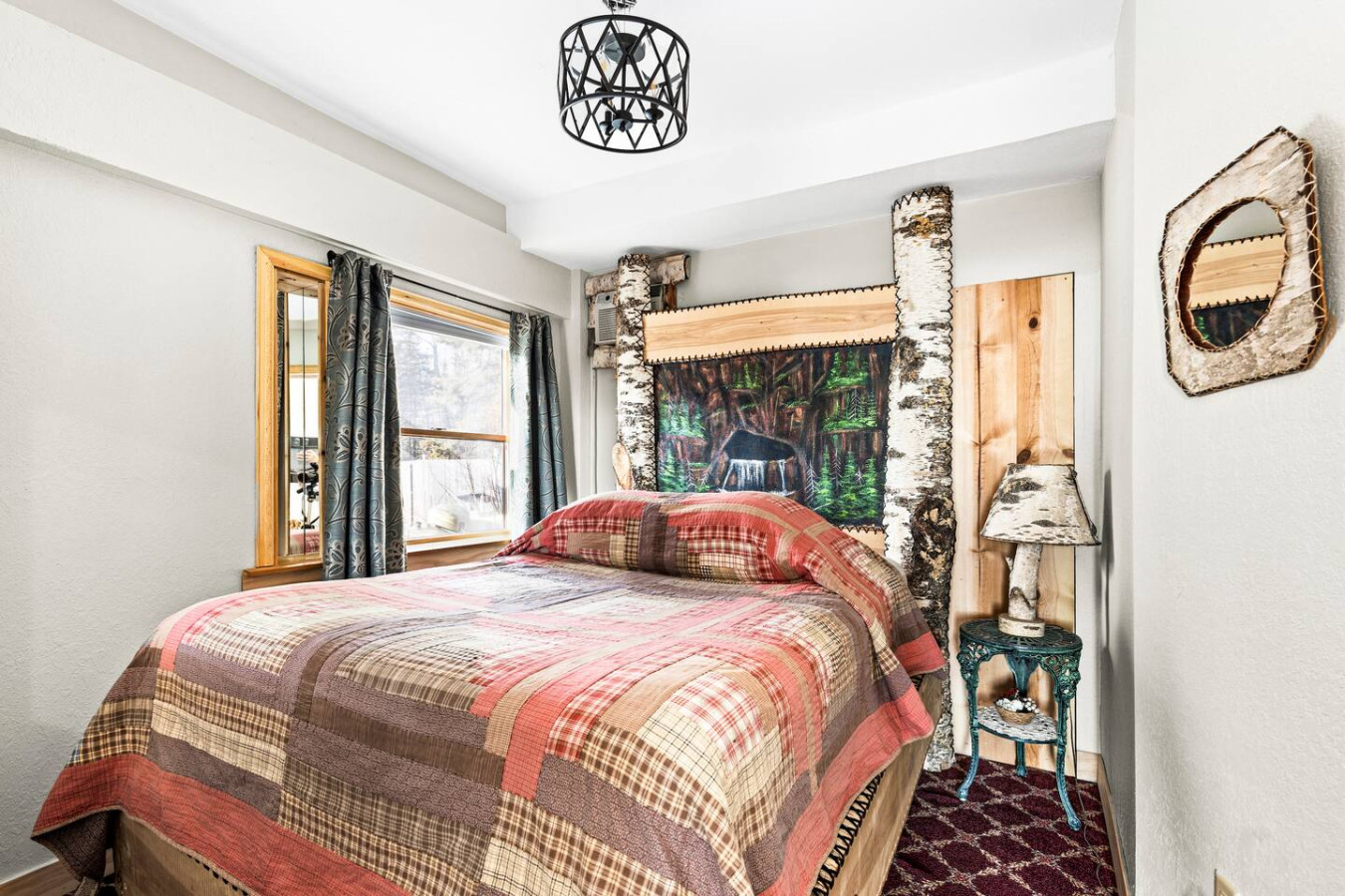 Hand stitched quilts and birch bed accents