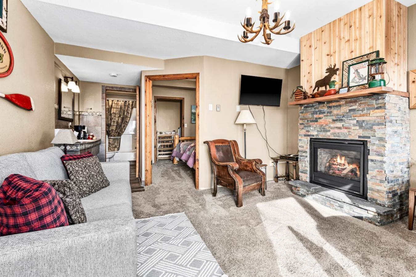 Beautiful gas fireplace with a room and board sofa (which doubles as a queen memory foam bed)