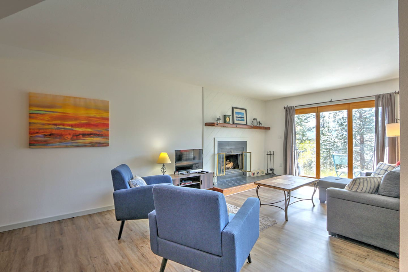 Living room with fireplace and walk out back porch