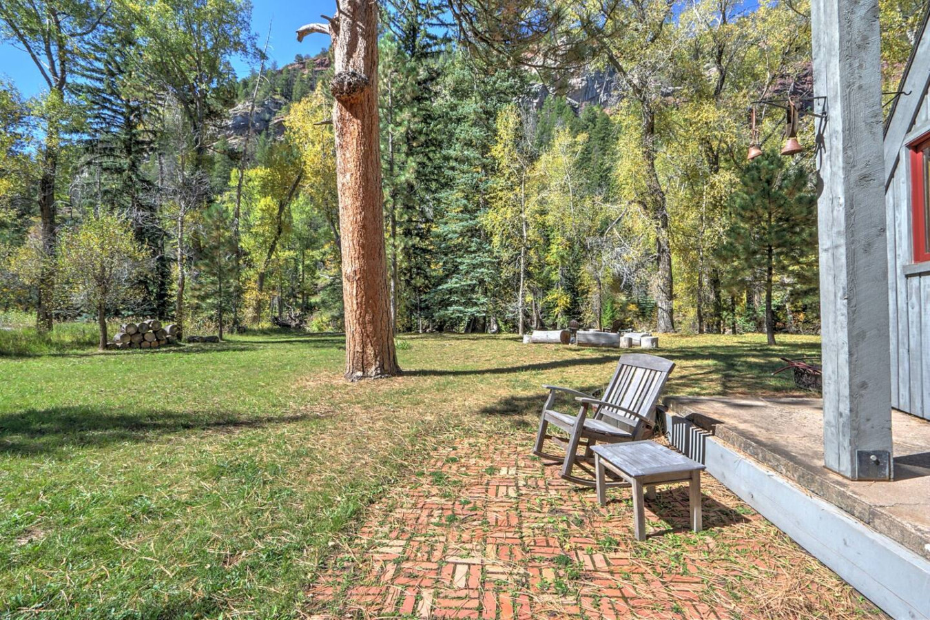 Back patio seating near river access