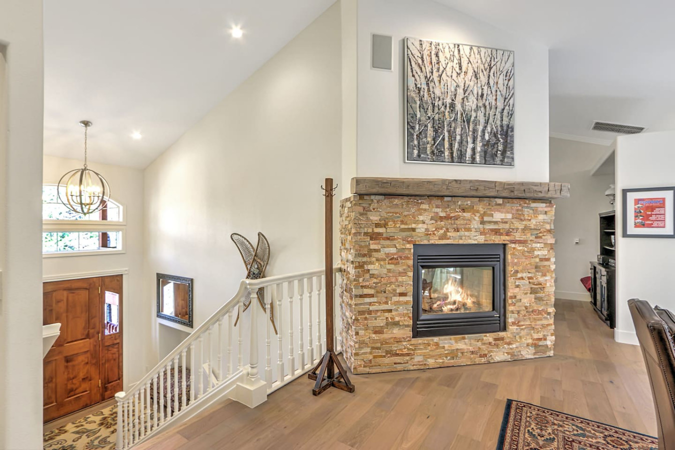 Dining room fireplace with view of entrance