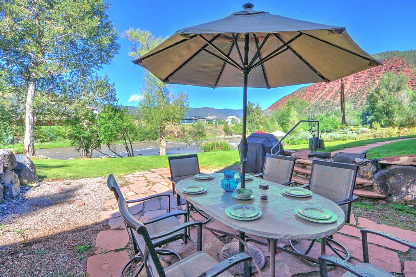 Upper patio seating area near apartment entrance