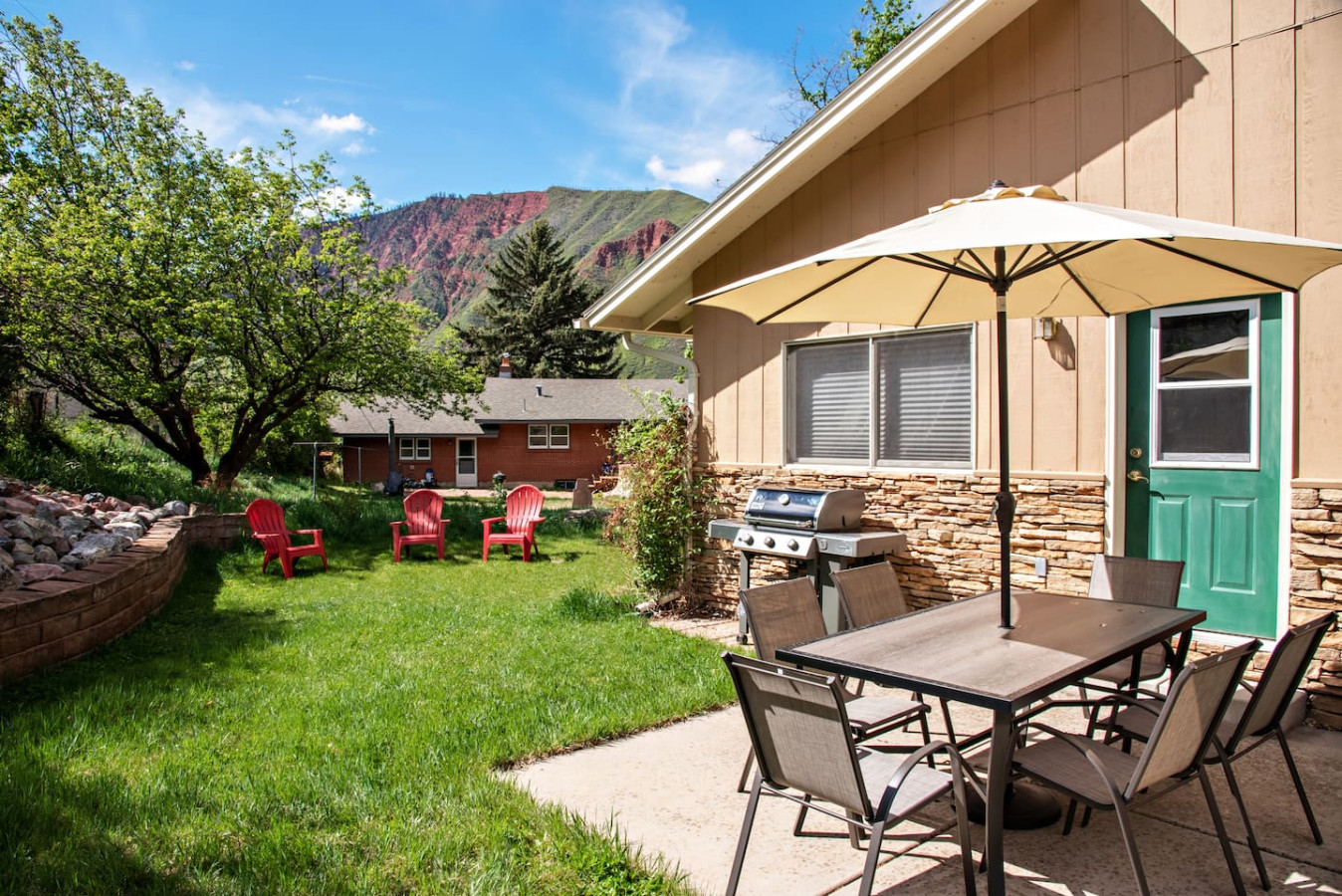 Backyard dining area and lawn