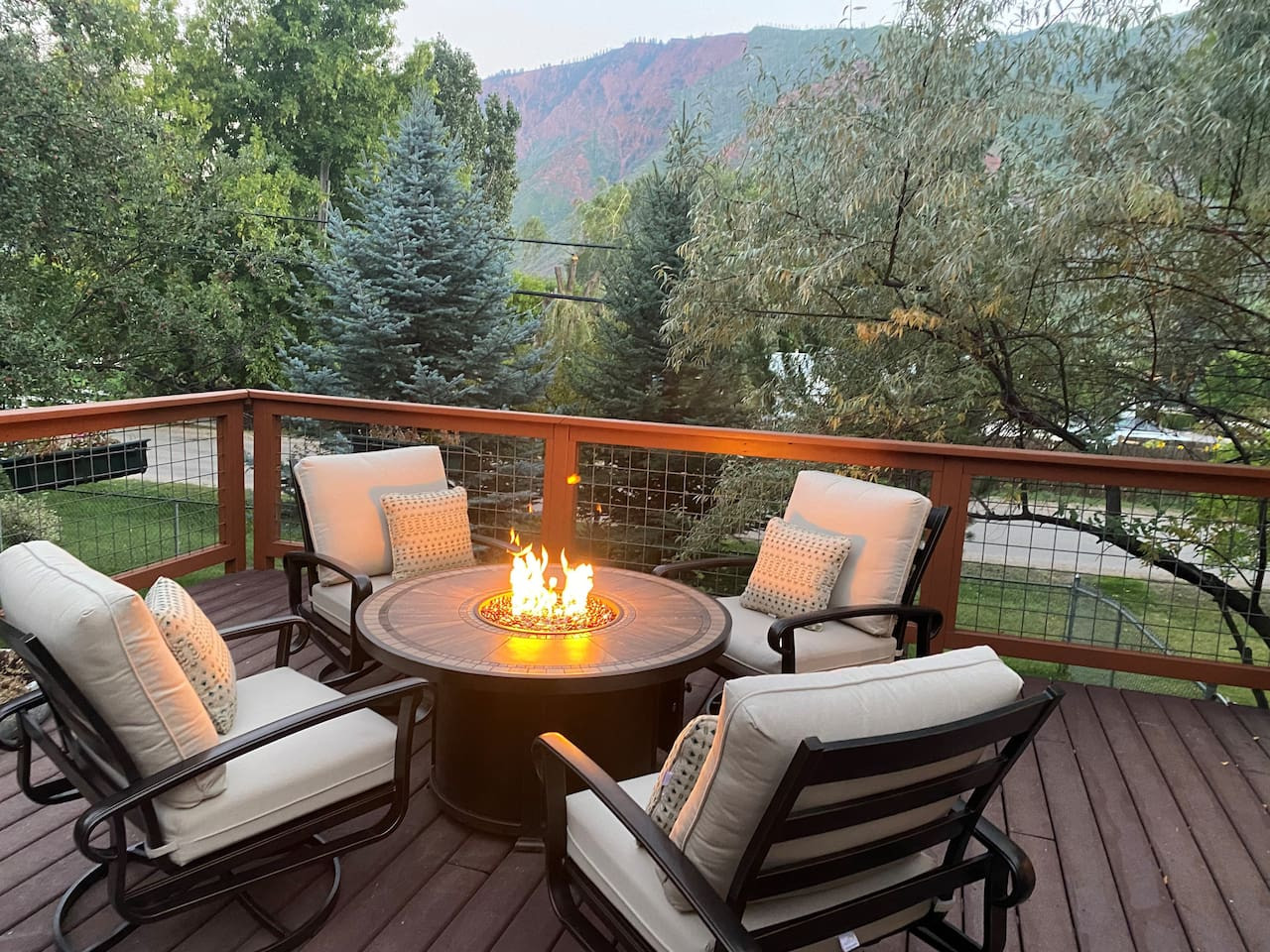 Outdoor seating and fire pit at night