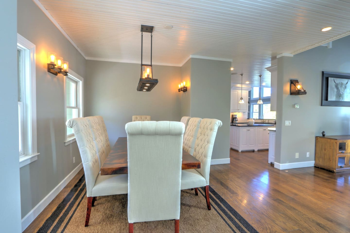 Formal dining room with seating for 8 and view into kitchen