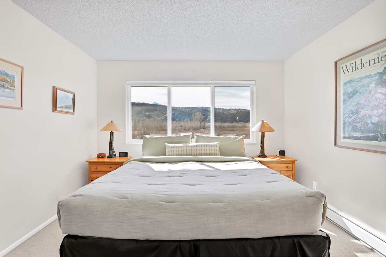 Primary bedroom with king bed and majestic views of pond and mountains!