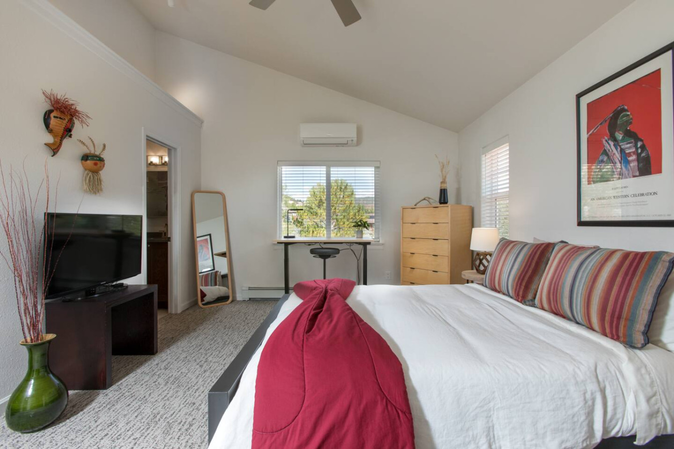 Primary Room with Queen Bed, EnSuite Bathroom,  TV, and Work Desk
