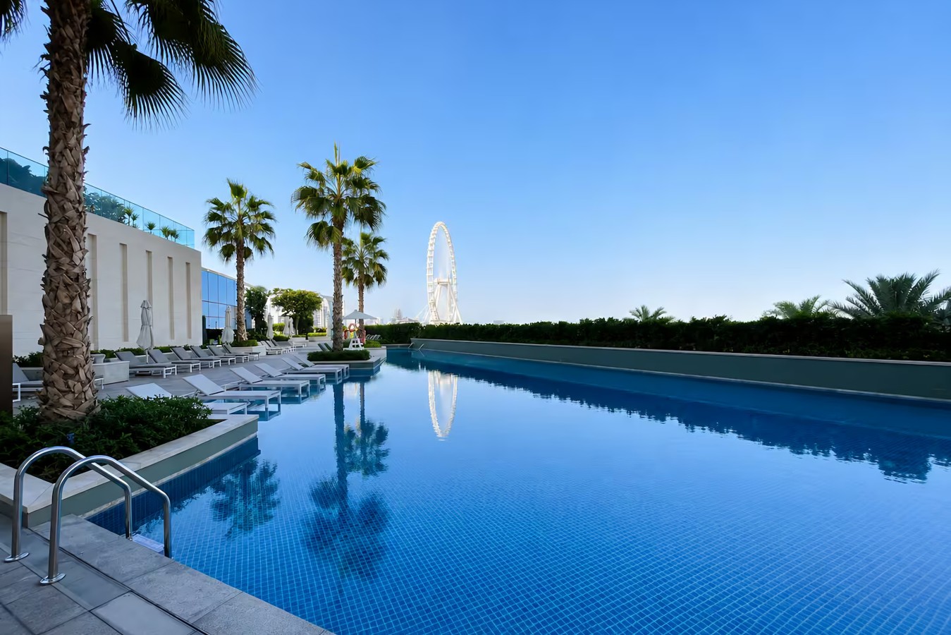 Poolside Paradise: Dive into luxury with a sparkling pool and stunning views of the Dubai Eye!