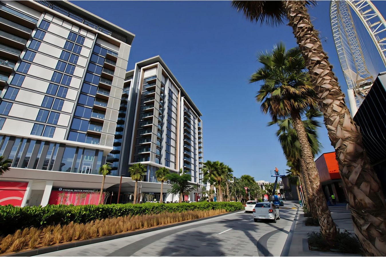 Exterior View: Modern architecture meets vibrant palm-lined streets in the heart of Dubai!