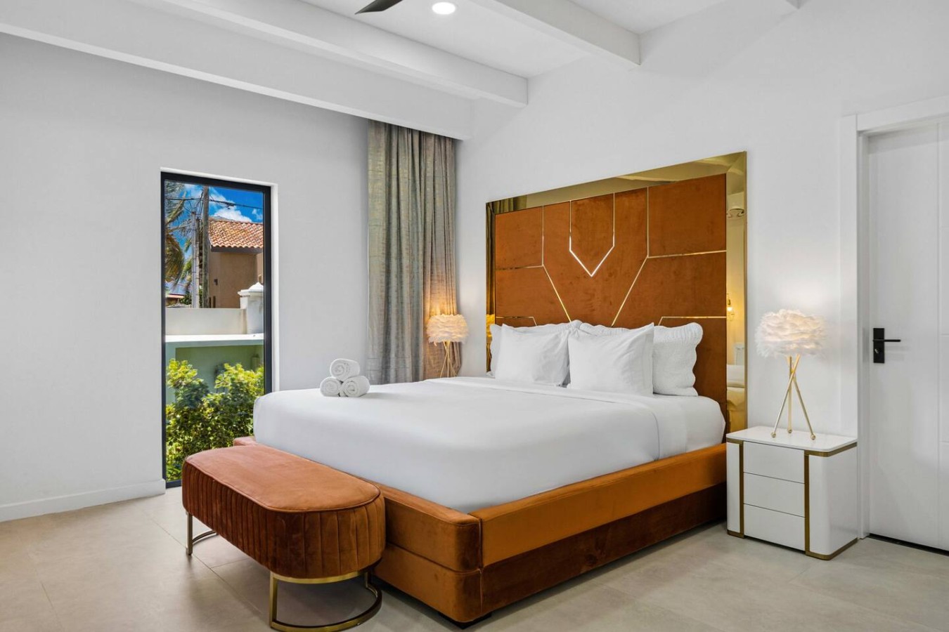 Experience effortless relaxation with sleek design, plush bedding, tropical views, and the privacy of your own en-suite bathroom.