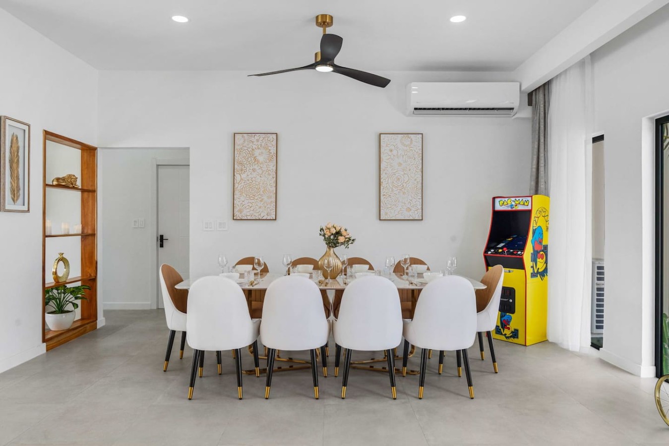 Create lasting memories around the stylish dining table, with a fun Pac-Man arcade game adding a playful touch to every gathering.