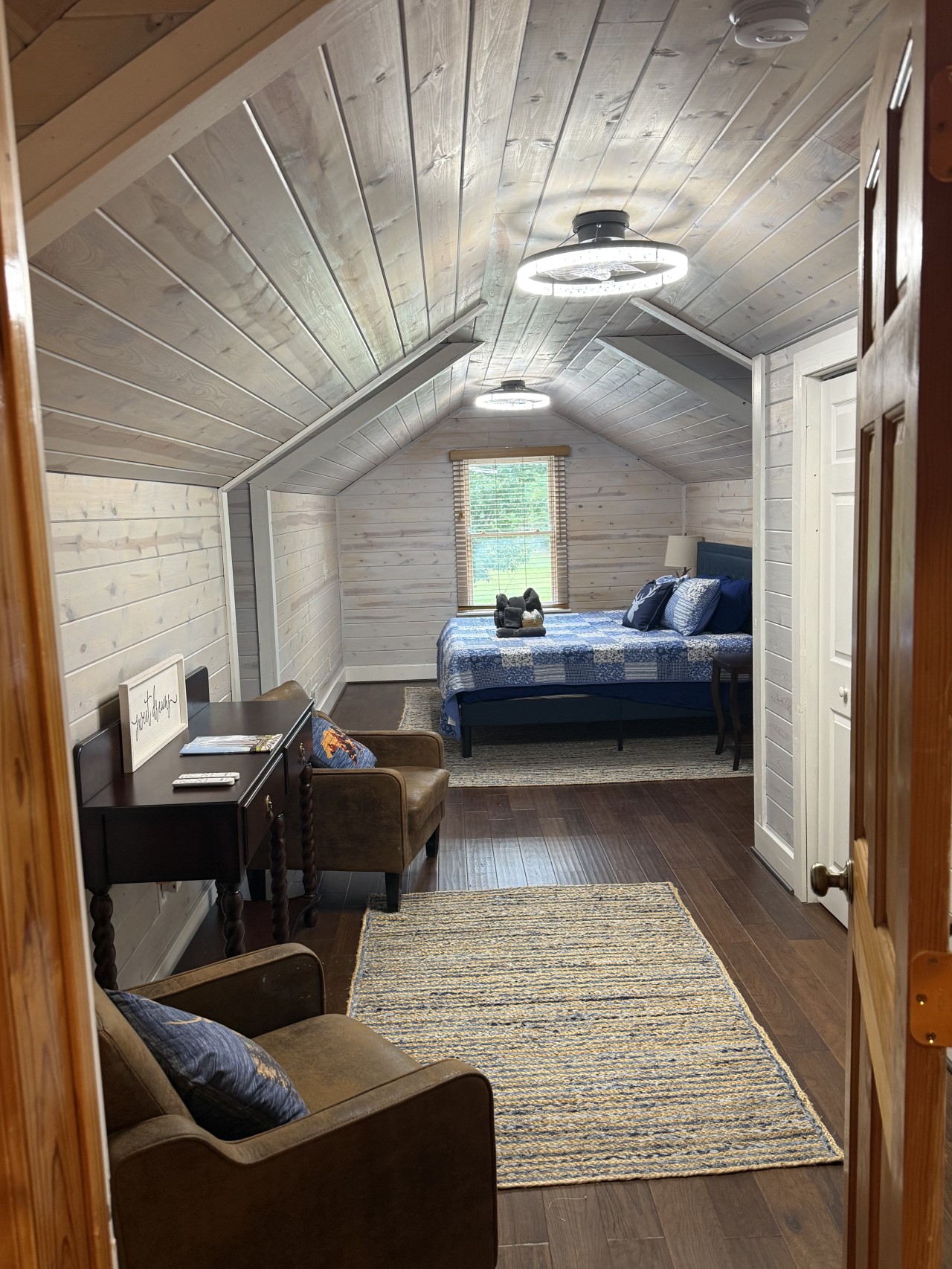 Loft suite – sitting area through to the bed