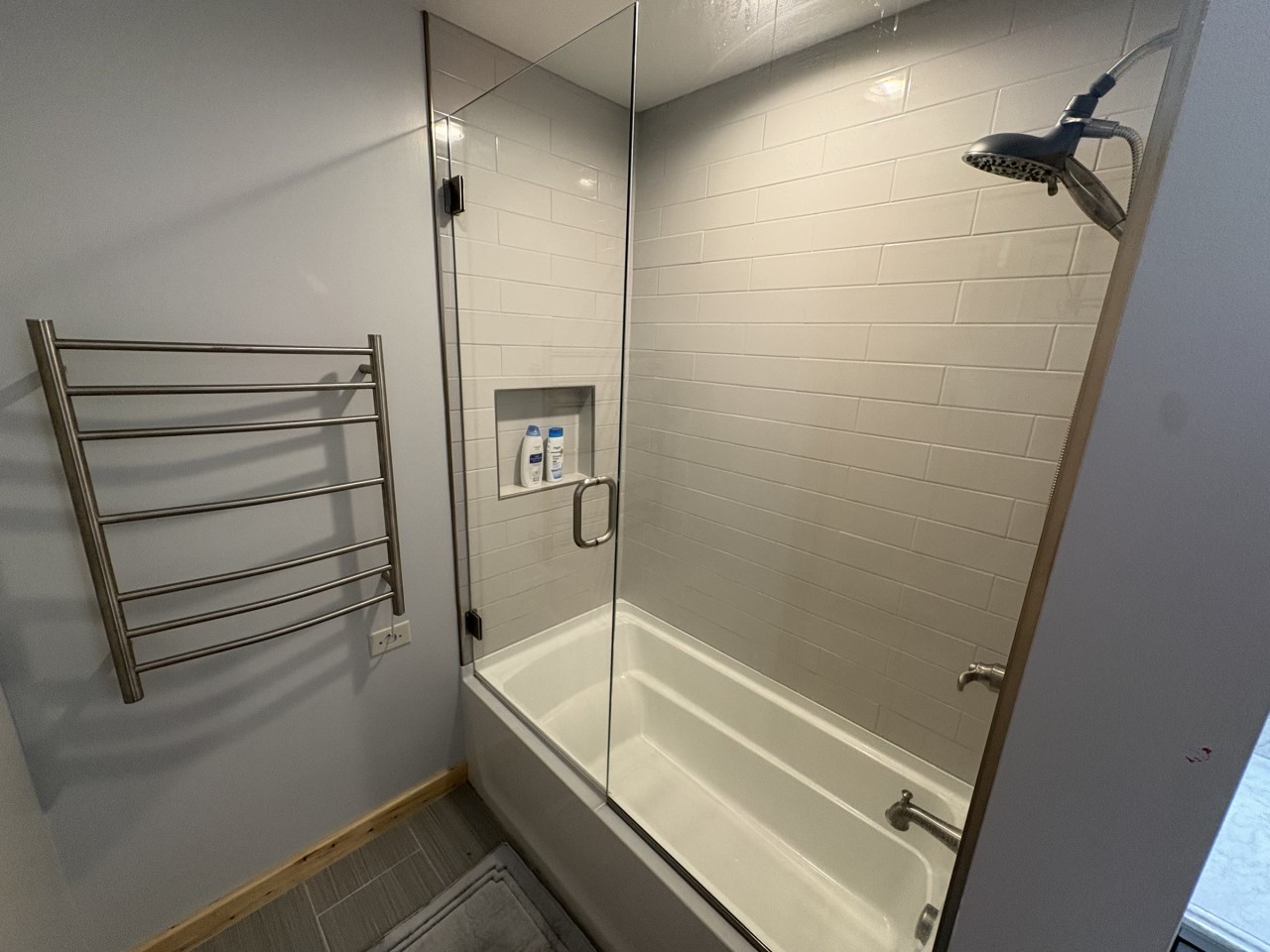 Lower-level bath, tub shower and towel warmer.jpg