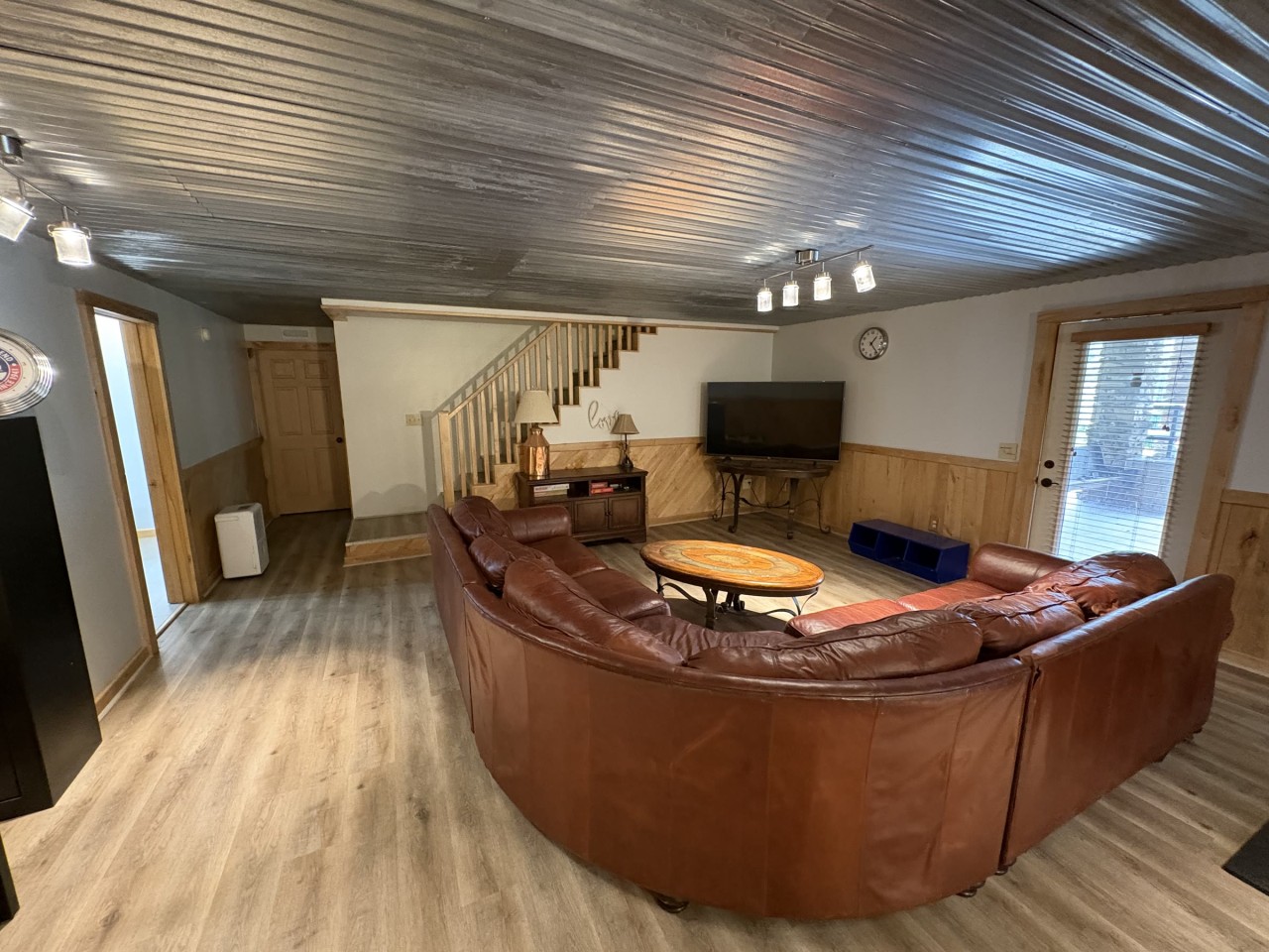 Lower-level rec room with a big sectional.jpg