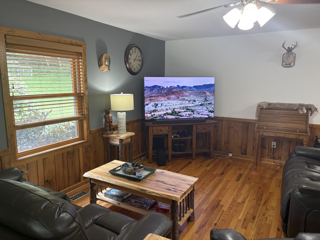 Living room with recliners and a large TV.jpg