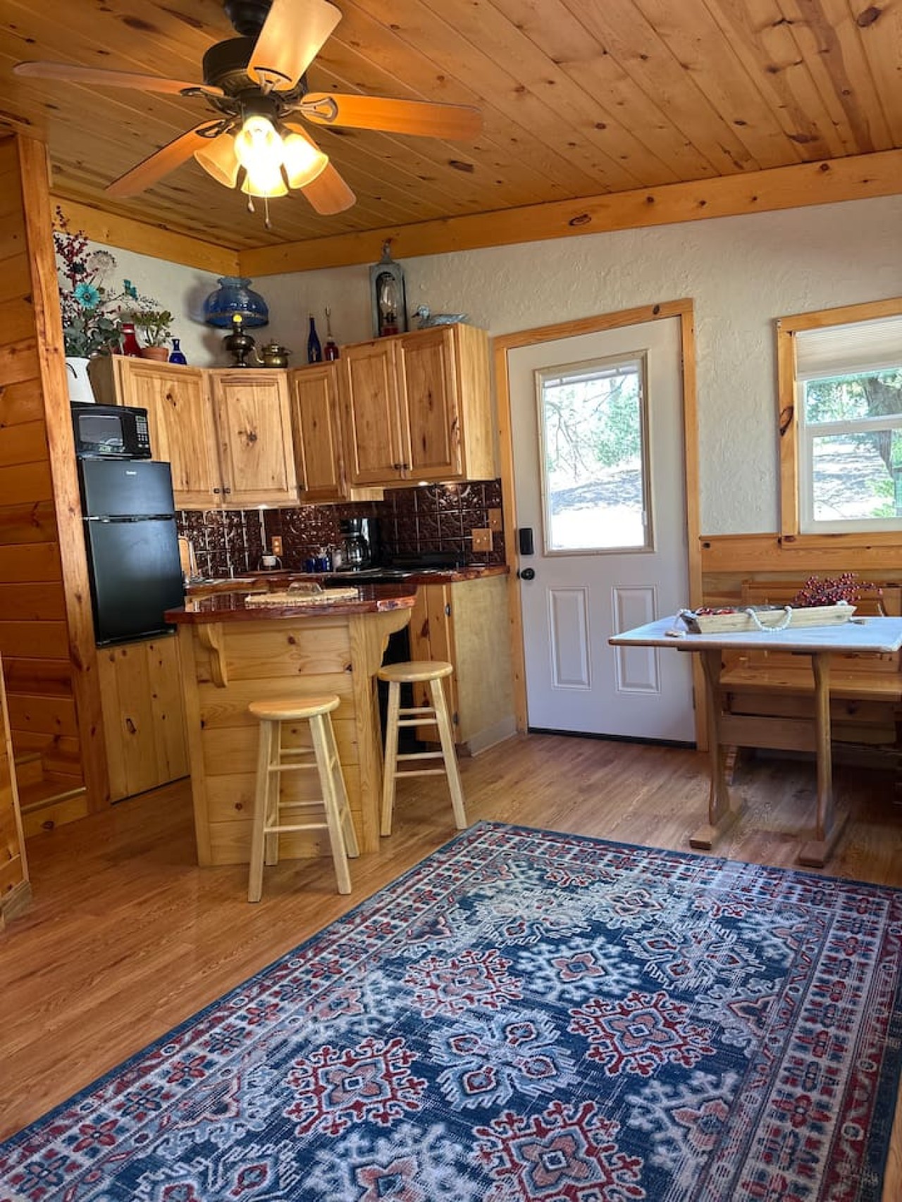 Kitchen, dining and living area with fireplace.