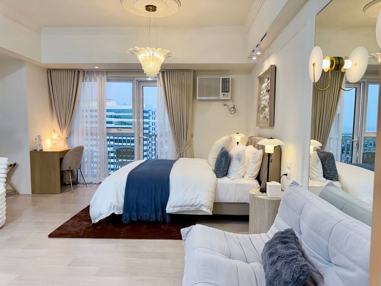 This bedroom features a cozy queen-size bed with a medium-firm mattress, perfect for a restful night's sleep. You'll also find soft pillows, comfy bedding, and blackout curtains to help you relax and wake up feeling refreshed.