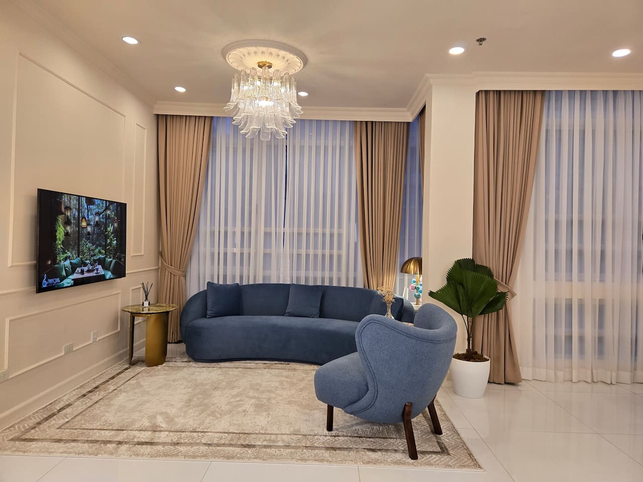 Our living room is thoughtfully curated to offer a perfect blend of comfort, warmth, and luxury—an inviting space designed for relaxation, connection, and feeling at home.