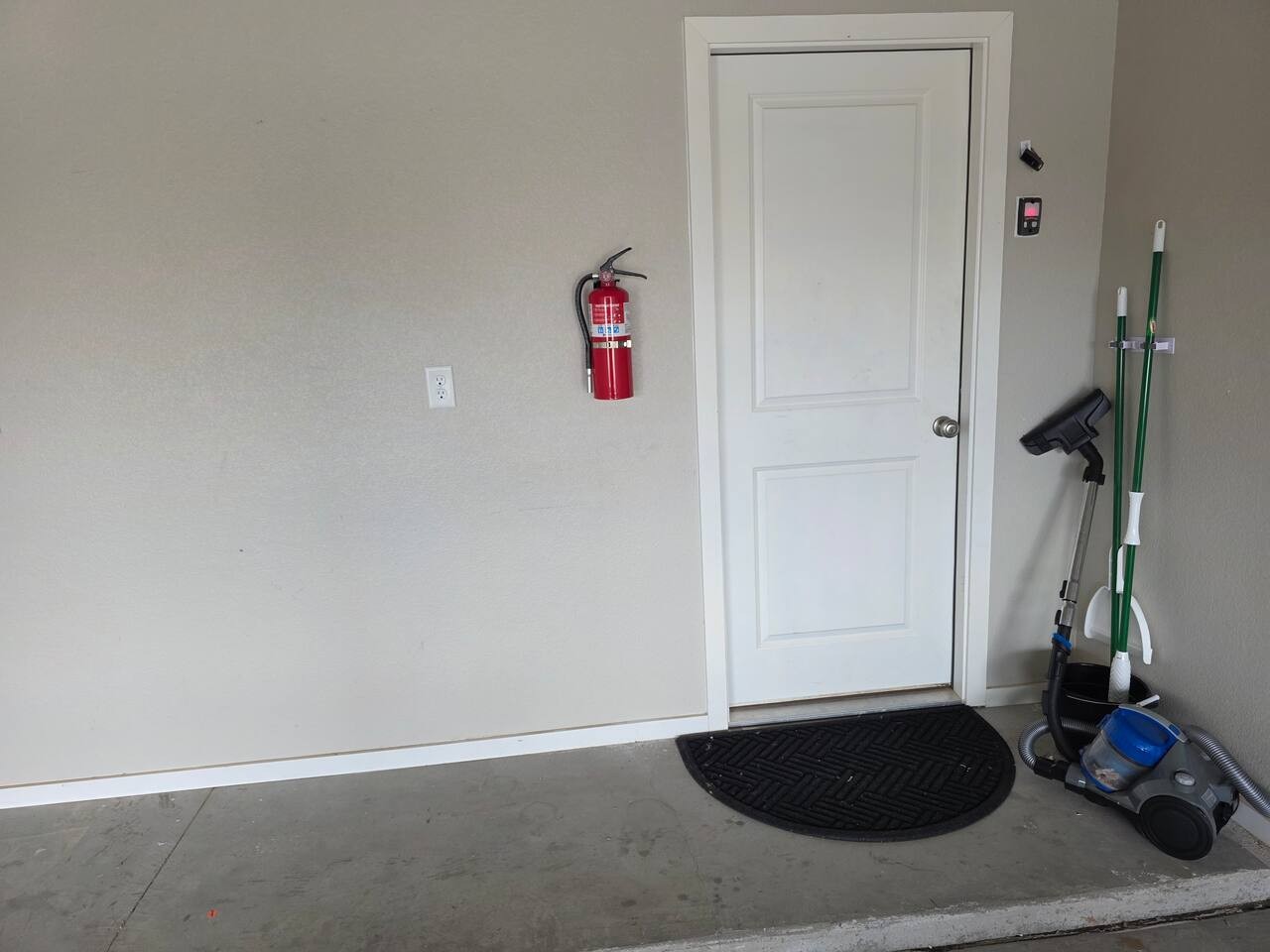 Attached garage entry at Basin Haven, one of two Basin Stays properties in Odessa