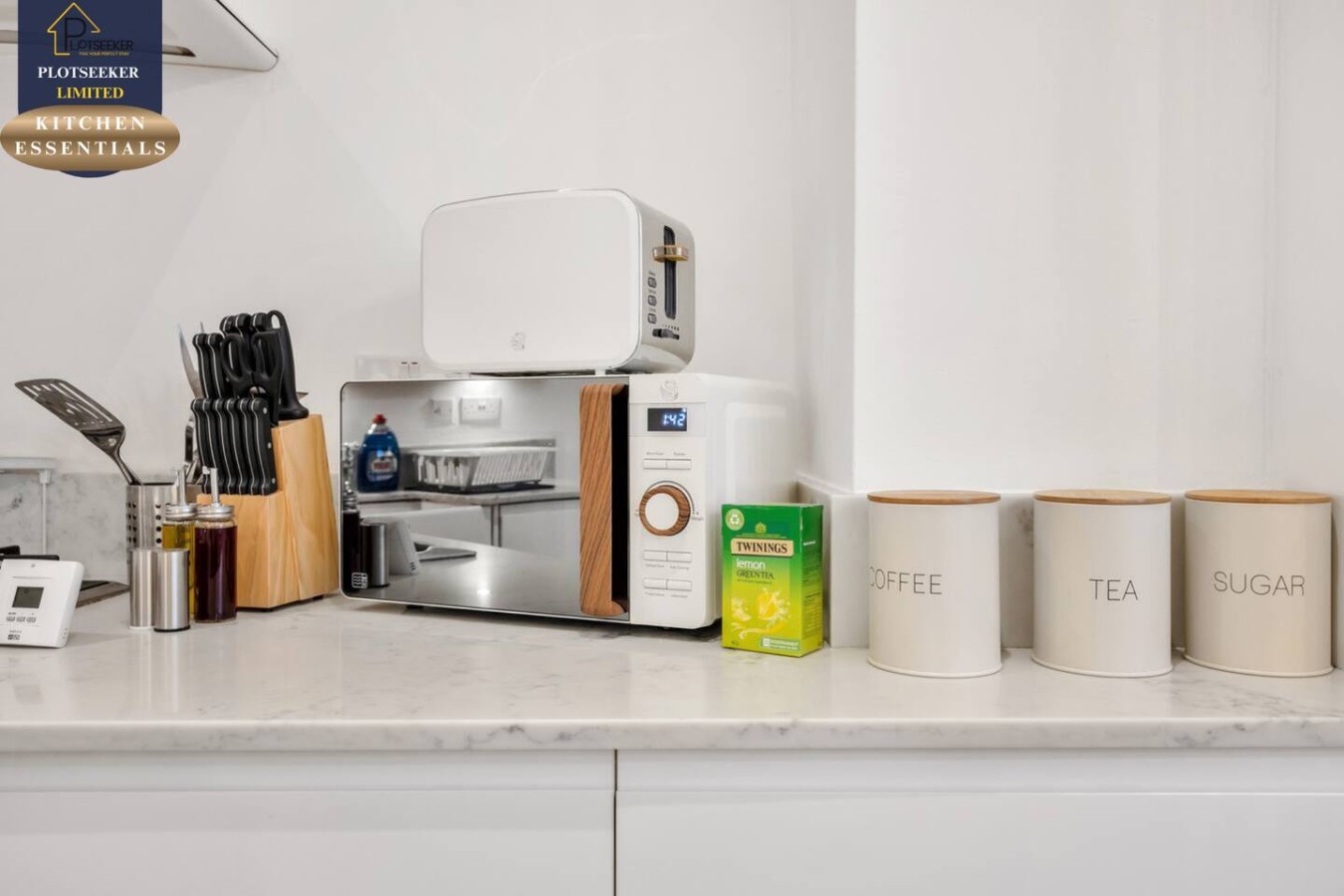 KITCHEN WITH MICROWAVE AND ESSENTIALS