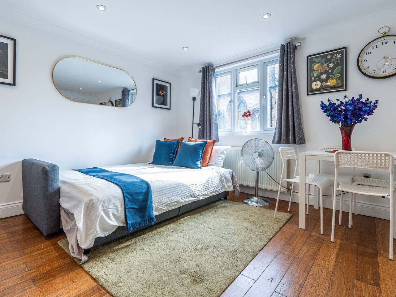 Double Sofa Bed and Portable Fan in Living room