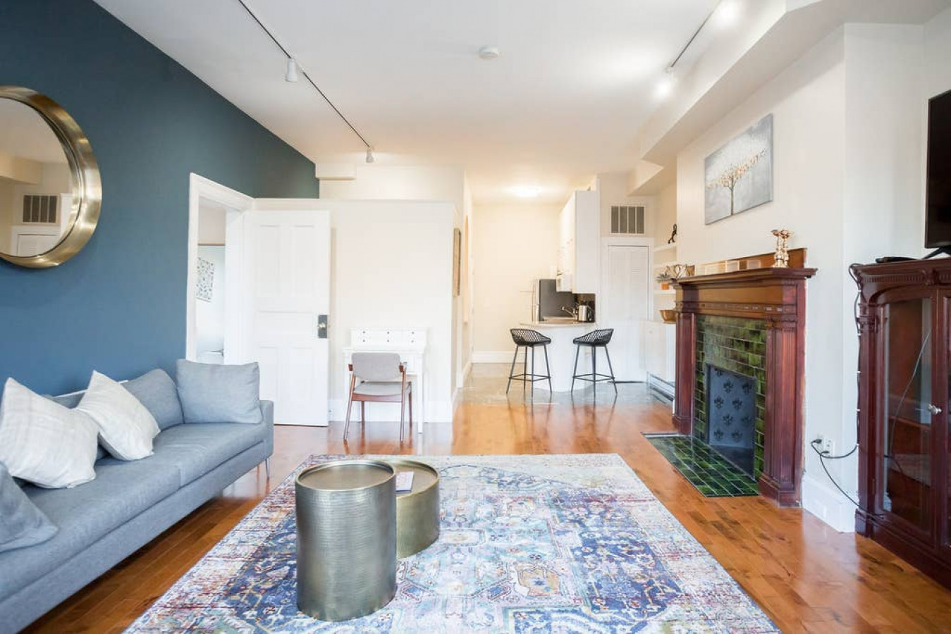 Large open concept kitchen/living area with workspace.