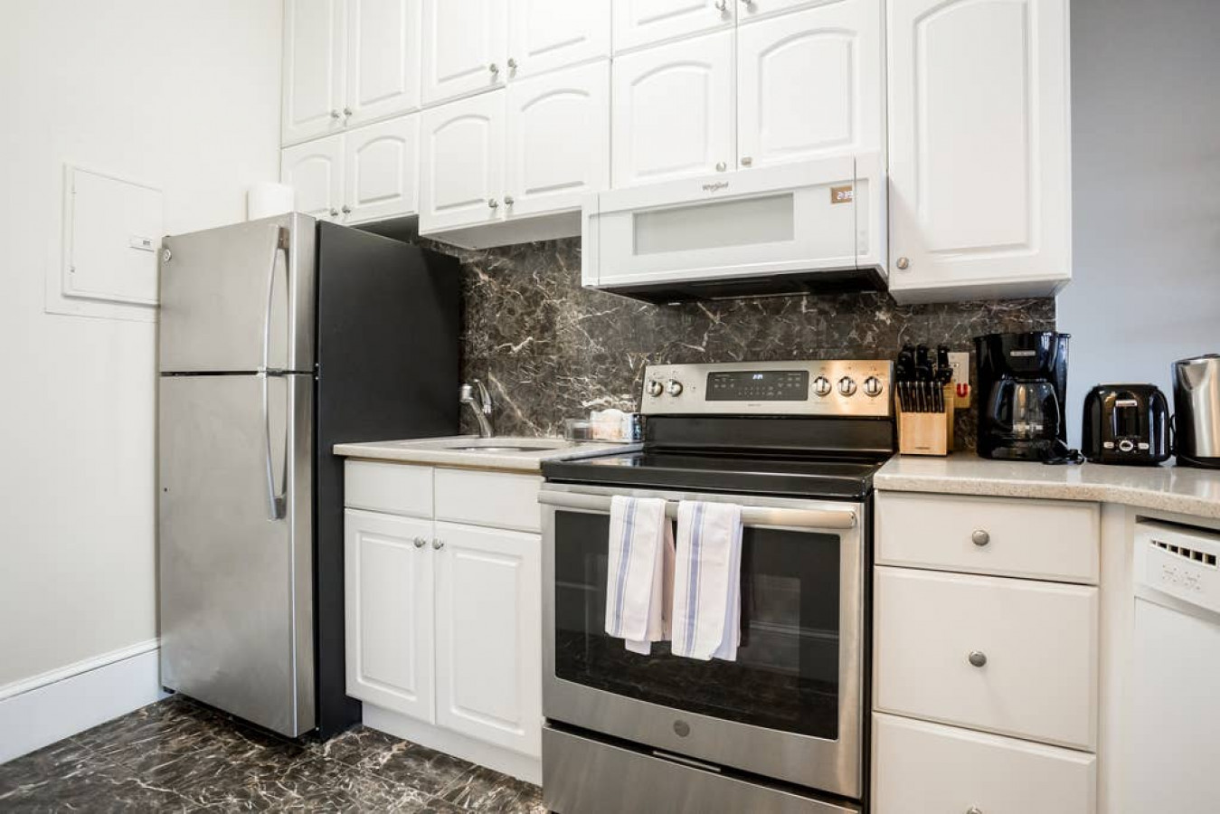 Fully stocked kitchen, utensils, pots, pans, dish towels, bowls, mugs, wine glasses, water glasses, appliances, etc.