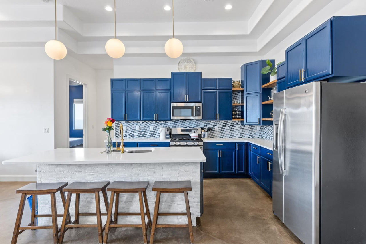 Fully stocked kitchen with stainless steel appliances