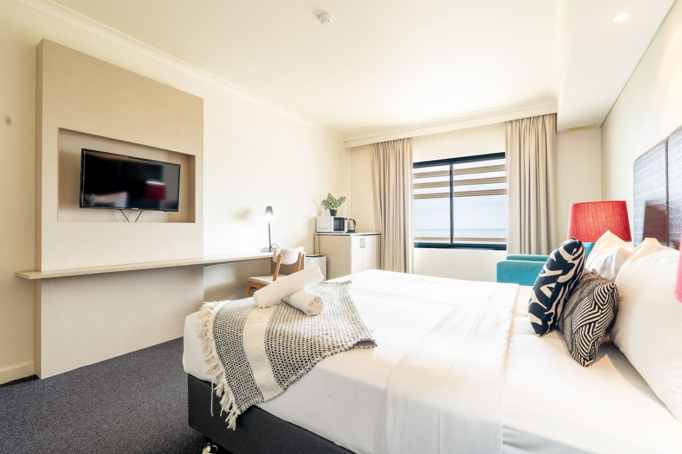 ZEN88 ESPLANADE: Hotel Suite w/ Ocean/Sunset Views - Indulge in luxury and style in our elegantly designed bedroom, a haven of tranquility and beauty.