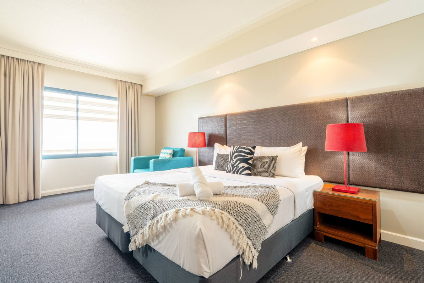 ZEN88 ESPLANADE: Hotel Suite w/ Ocean/Sunset Views - "Experience the perfect blend of opulence and comfort in our chic and elegant bedroom